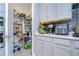 Well-organized pantry with ample shelving for storage at 2406 High Tides Way, Wesley Chapel, FL 33543