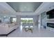 Spacious living room with a fireplace and sliding glass doors at 2406 High Tides Way, Wesley Chapel, FL 33543