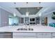 Modern kitchen with white cabinets, large island, and stainless steel appliances at 2406 High Tides Way, Wesley Chapel, FL 33543