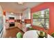Modern kitchen featuring white cabinets, granite countertops, and stainless steel appliances at 301 N Glen Ave, Tampa, FL 33609