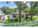 Aerial view showing the house and a white picket fence at 301 N Glen Ave, Tampa, FL 33609