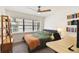 Bedroom with a double bed, large window, and built-in shelving at 301 N Glen Ave, Tampa, FL 33609