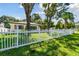 Front yard view of the house with a white picket fence at 301 N Glen Ave, Tampa, FL 33609