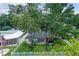 Charming house nestled among lush trees with a fenced yard at 301 N Glen Ave, Tampa, FL 33609