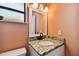 Updated bathroom with granite countertop and a white vanity at 301 N Glen Ave, Tampa, FL 33609
