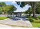 Home with a long driveway and white fence at 301 N Glen Ave, Tampa, FL 33609