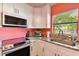 Modern kitchen corner with granite countertops and stainless steel appliances at 301 N Glen Ave, Tampa, FL 33609