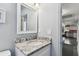Small bathroom with granite countertop and white vanity at 301 N Glen Ave, Tampa, FL 33609