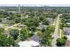High-angle view showcasing a home's position in a residential area with a distant city skyline at 301 N Glen Ave, Tampa, FL 33609
