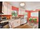 Updated kitchen featuring white shaker cabinets and granite countertops at 301 N Glen Ave, Tampa, FL 33609