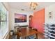 Casual dining area with a wooden table and shoe storage at 301 N Glen Ave, Tampa, FL 33609
