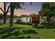House exterior at sunset, featuring a white exterior and wood accents at 301 N Glen Ave, Tampa, FL 33609