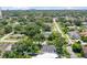 Aerial perspective of a house in a residential neighborhood, showcasing its surroundings and the distant city at 301 N Glen Ave, Tampa, FL 33609