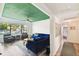 Open living space with a blue sofa and view into hallway at 301 N Glen Ave, Tampa, FL 33609