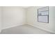 Simple bedroom with window and carpet at 2613 Star Apple Way, Sarasota, FL 34240