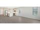 Open concept kitchen with stainless steel appliances and an island at 2613 Star Apple Way, Sarasota, FL 34240