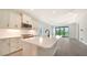 Modern kitchen with stainless steel appliances and an island at 2613 Star Apple Way, Sarasota, FL 34240
