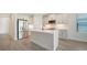 Modern kitchen with stainless steel appliances and an island at 2613 Star Apple Way, Sarasota, FL 34240
