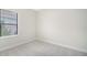 Simple bedroom with window and carpet at 2613 Star Apple Way, Sarasota, FL 34240