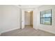 Spacious bedroom with tile floor, large window, and access to another room at 2613 Star Apple Way, Sarasota, FL 34240
