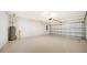 Garage with floor, water heater, and opener at 2613 Star Apple Way, Sarasota, FL 34240