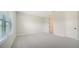 Bedroom with carpet, window, and access to bathroom at 2613 Star Apple Way, Sarasota, FL 34240