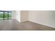 Bright and spacious living room with hardwood floors and sliding doors at 2613 Star Apple Way, Sarasota, FL 34240