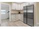 Modern kitchen with stainless steel appliances and white cabinets at 609 N Osceola Ave, Clearwater, FL 33755