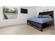 Cozy bedroom with a double bed and light wood floors at 609 N Osceola Ave, Clearwater, FL 33755