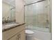 Clean bathroom with granite countertop and tub shower combo at 609 N Osceola Ave, Clearwater, FL 33755