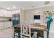 Bright dining area with rustic farmhouse table and chairs at 609 N Osceola Ave, Clearwater, FL 33755