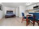 Bright studio features a comfortable bed, dining table, and kitchenette at 609 N Osceola Ave, Clearwater, FL 33755