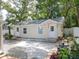 Quaint cottage-style home with a spacious backyard and patio area at 609 N Osceola Ave, Clearwater, FL 33755