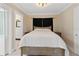 Bright bedroom with simple decor and access to a walk-in closet at 609 N Osceola Ave, Clearwater, FL 33755