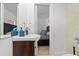 Bathroom with a white sink vanity and a view into the bedroom at 609 N Osceola Ave, Clearwater, FL 33755