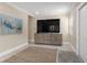 Media room with large TV and built-in entertainment center at 609 N Osceola Ave, Clearwater, FL 33755