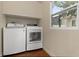 Bright laundry room with washer and dryer at 609 N Osceola Ave, Clearwater, FL 33755