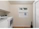 Laundry room with washer, dryer and overhead shelving at 609 N Osceola Ave, Clearwater, FL 33755
