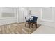 Small dining area with a round table and blue chairs at 609 N Osceola Ave, Clearwater, FL 33755