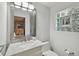 Bright bathroom features a marble vanity, modern lighting, and a unique glass block window at 4950 Bayshore Blvd # 23, Tampa, FL 33611