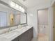 Bright, clean bathroom featuring dual sinks, modern fixtures, and a separate toilet room at 4950 Bayshore Blvd # 23, Tampa, FL 33611