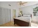 Comfortable bedroom with light wood floors, large closet, and en-suite bathroom at 4950 Bayshore Blvd # 23, Tampa, FL 33611