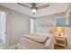 Bright bedroom with natural light, wood floors, en-suite bathroom and neutral colors at 4950 Bayshore Blvd # 23, Tampa, FL 33611