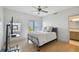 Bedroom with water view, light-colored floors, and a ceiling fan at 4950 Bayshore Blvd # 23, Tampa, FL 33611