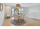 Dining area featuring a round table with seating for four and a view of the waterfront at 4950 Bayshore Blvd # 23, Tampa, FL 33611