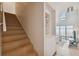 Hallway staircase with built-in shelving and access to the living area and floor to ceiling windows at 4950 Bayshore Blvd # 23, Tampa, FL 33611