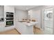 Bright kitchen with a large center island with cooktop, stainless steel appliances and ample cabinets at 4950 Bayshore Blvd # 23, Tampa, FL 33611