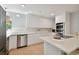 Spacious kitchen with stainless steel appliances, white cabinets, and a large center island at 4950 Bayshore Blvd # 23, Tampa, FL 33611