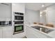 Bright kitchen includes stainless steel appliances, cooktop island, and ample cabinet space at 4950 Bayshore Blvd # 23, Tampa, FL 33611