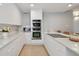 Bright kitchen features stainless steel appliances, custom cabinets, and a central island cooktop at 4950 Bayshore Blvd # 23, Tampa, FL 33611